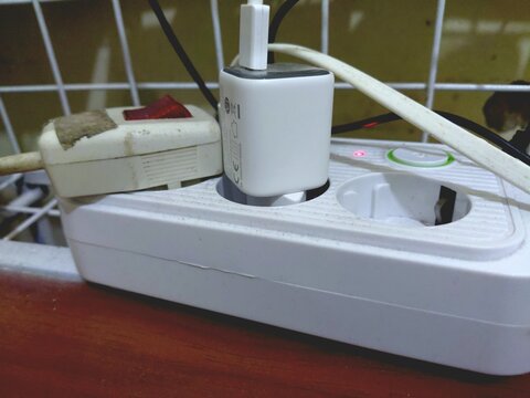 charge adapter and power socket on the table