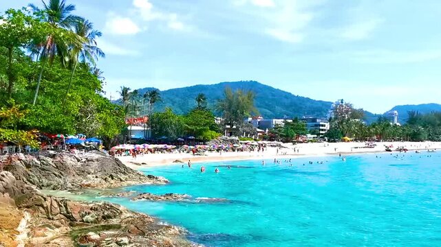 Tropical Patong Kamala Beach Phuket Thailand tourists people parasol palm.