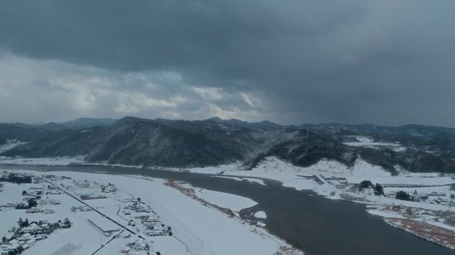 Aerial Drone View of Hii River in Izumo Japan Covered with Snow &ndash; Winter Landscape