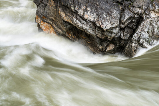 Canada, BC, Valemont.  Water surging around rocks in Little Hells Gate Park on the North Thompson River