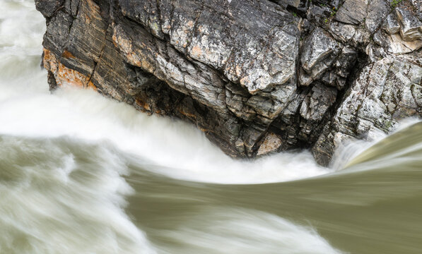 Canada, BC, Valemont.  Water surging around rocks in Little Hells Gate Park on the North Thompson River