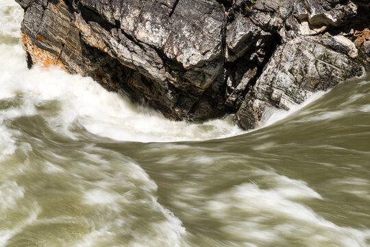 Canada, BC, Valemont.  Water surging around rocks in Little Hells Gate Park on the North Thompson River