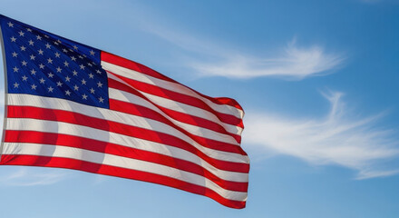 Obraz premium American flag waving in the blue sky