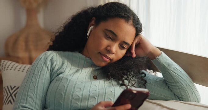 Home, relax and woman on sofa, smartphone and earphones for meditation podcast. Resting, connection and person on couch, comfort or cellphone for wellness app and listening to calm sound or audio