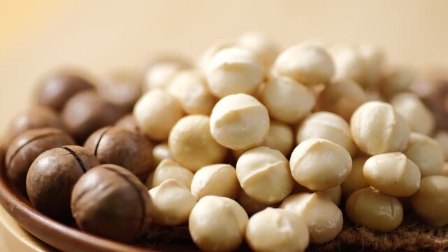 Video of macadamia nuts on a white background.