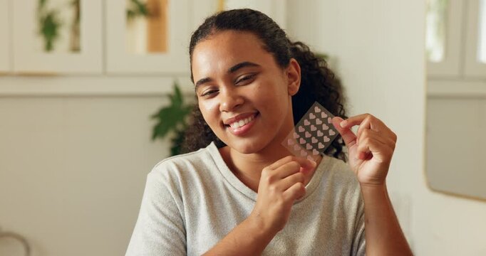 Face, woman and pimple patch in bathroom with skincare, blemish control and hydrocolloid benefits. Happy, female person and cosmetic product in house for acne treatment, zit sticker and dermatology.