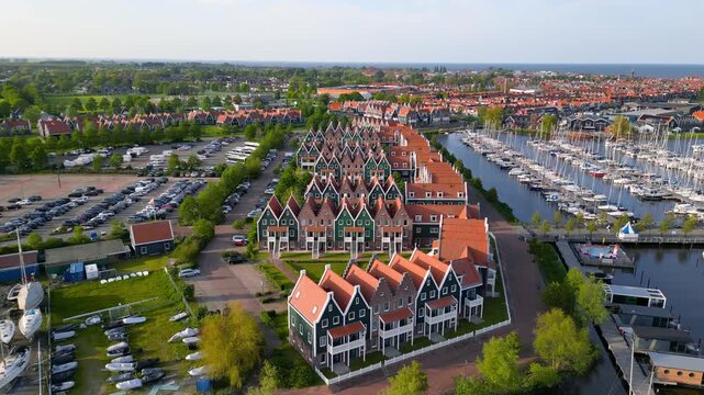 Picturesque aerial view of traditional Dutch houses and marina in the fishing village of Volendam in the Netherlands.