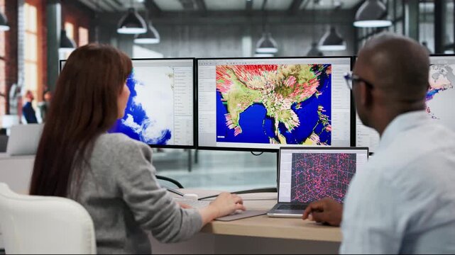 Meteorologists Monitoring Hurricane Forecast