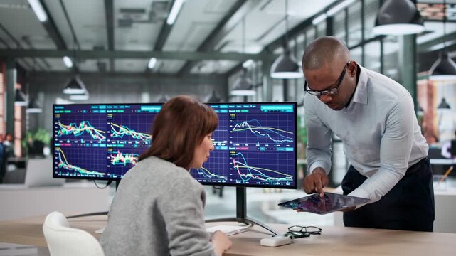 Young African American Woman And Man Trade Stocks Online