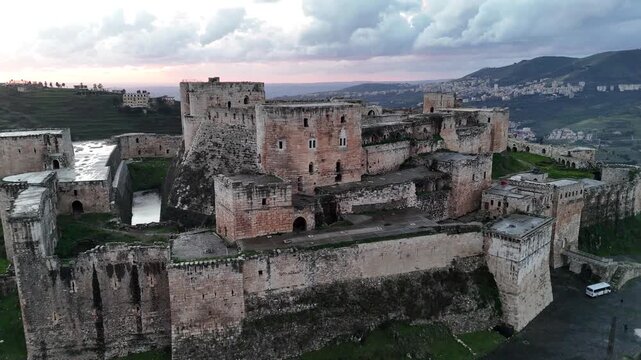 aerial view of Krak des Chevaliers, the world's best-preserved Crusader castle, situated on a hilltop in Syria Chevaliers fortress, a UNESCO World Heritage site
