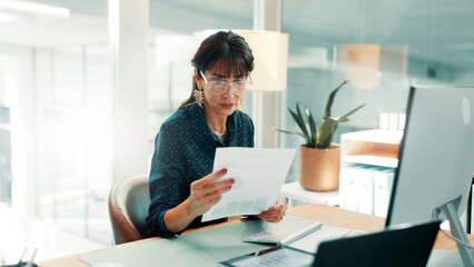 Fototapeta na wymiar Investor, reading and woman in office, documents for economy stats and profit growth for company. Mature person, financial advisor and paperwork for trading charts and report for investment audit