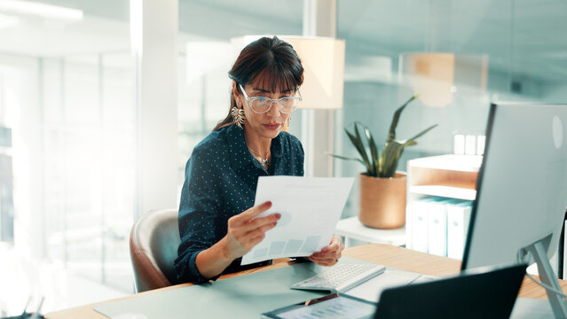 Investor, reading and woman in office, documents for economy stats and profit growth for company. Mature person, financial advisor and paperwork for trading charts and report for investment audit