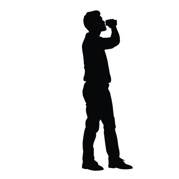 Young Man Silhouette Standing and Drinking from Aluminum Soda Can Side View Profile Refreshment Break Cold Drink and Beverage Lifestyle Concept Image