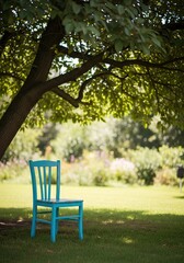 Obraz premium Sun Faded Blue Wooden Chair Under Large Leafy Tree in Peaceful Sunwashed Summer Garden with Soft Focus Background