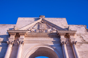 Obraz premium &nbsp;Porta Napoli, the grand triumphal arch welcoming visitors to the Baroque city of Lecce, southern Italy
