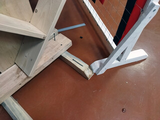 Wooden structure supporting a sports net in an indoor facility © MikeLegend