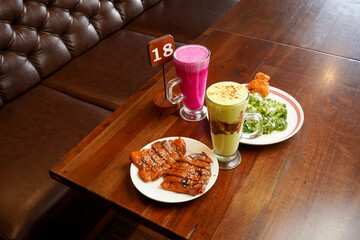 Asian Restaurant Meal with Roasted Chicken Broccoli Avocado Juice and Dragon Fruit Juice