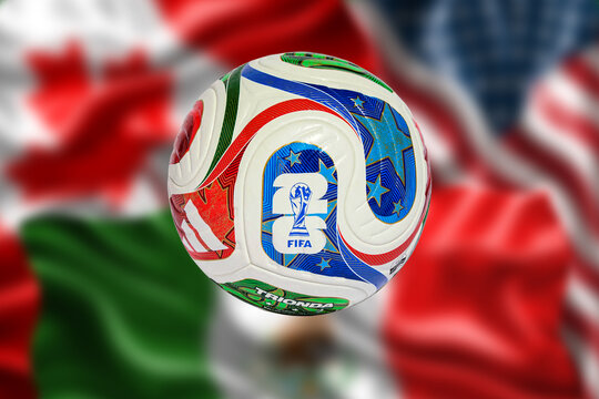 Adidas Trionda, official match ball for FIFA World Cup 2026 over blurred Mexico, USA and Canada flags, the three host nations of the tournament.