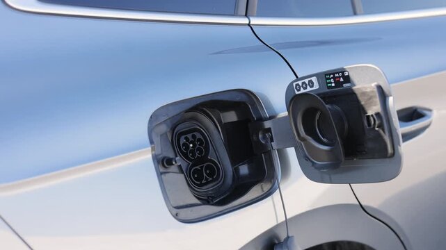 Fast charging socket type 2 combo electric car. Type 2 CCS plug port on electric vehicle. DC - CCS type 2 EV charging connector at EV car.Eco friendly alternative energy green environment concept