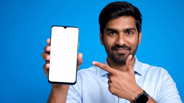 Collage of a friendly indian businessman showing a smartphone with a blank white screen. Positive adult male pointing at the device for a mobile app or website presentation