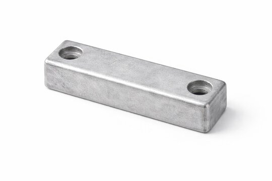 forged zinc sacrificial anode block isolated on white with refined matte metallic texture and soft industrial studio lighting