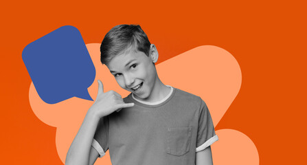 A young boy is making a playful gesture with his hand indicating a phone call. He stands in front of a colorful collage background. The scene captures a moment of fun and creativity. © Prostock-studio