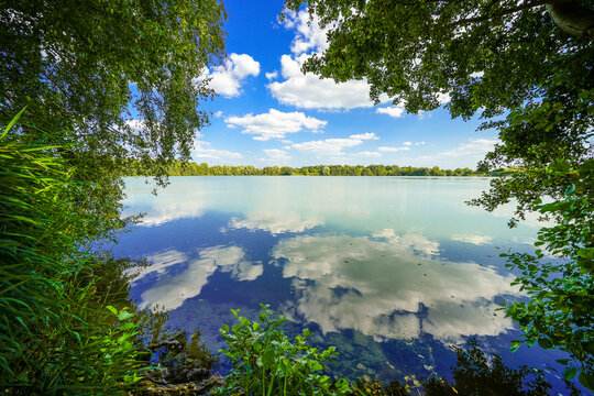 View of Lake Mastholte and the surrounding green landscape. Nature by the lake near Rietberg in the G&uuml;tersloh district.
