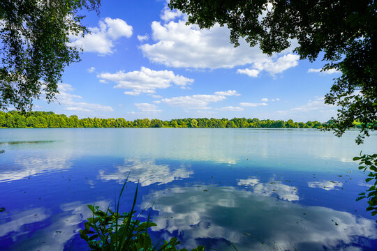 View of Lake Mastholte and the surrounding green landscape. Nature by the lake near Rietberg in the G&uuml;tersloh district.
