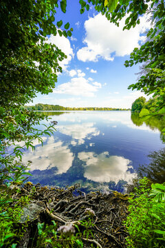 View of Lake Mastholte and the surrounding green landscape. Nature by the lake near Rietberg in the G&uuml;tersloh district.
