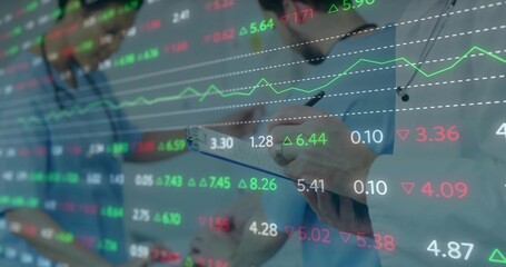 Holding clipboard and pen, three docs writing in clinic, in scrubs and steths, with stock tickers