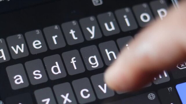 Typing message on smartphone keyboard, close up. sending text message using mobile phone. press touch screen keyboard keys. smart phone, dark mode display. texting online. web communication. send sms