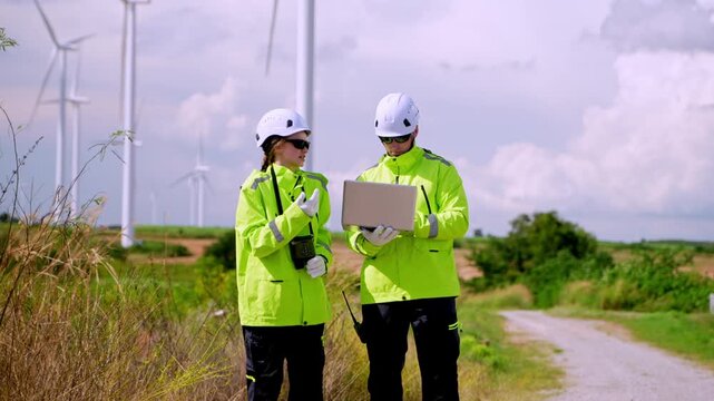 Monitoring renewable energy wind farm action scene rural setting close-up view sustainability awareness