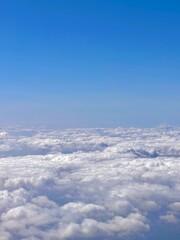 Fototapeta premium Cloudscape Above the Clouds with Blue Sky Horizon – Aerial Sky Background and Travel Concept