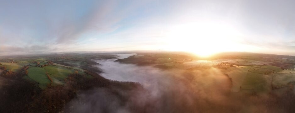 Hills countryside sunrise in morning fog - Arial drone view