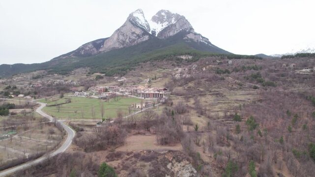 Aerial takes of the Pedraforca mountain in Catalonian Pyrenees covered by snow