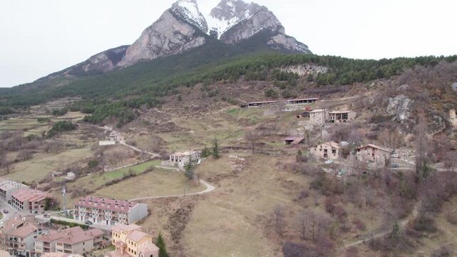 Aerial takes of the Pedraforca mountain in Catalonian Pyrenees covered by snow
