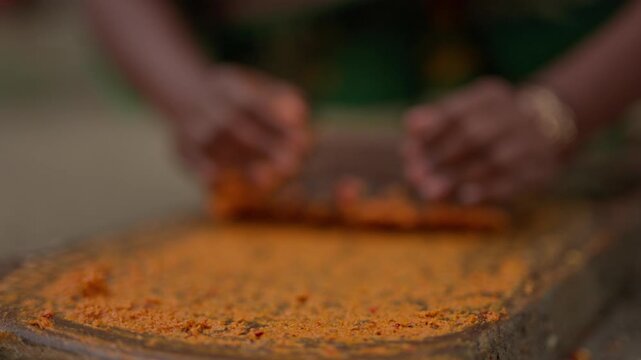 Hand carved Silauto Lohoro, a traditional stone grinder used for preparing spices, herbs, and condiments in South Asian kitchens. Represents cultural cooking tools and heritage food preparation.