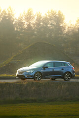 Fototapeta premium Modern sports wagon in natural landscape