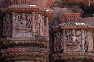 Fototapeta premium Intricate stone carvings of Hindu deities on the walls of Neelkantheshwar Shiva Temple at Udaipur, Madhya Pradesh, India