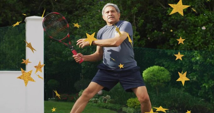 Senior man tracking ball, hitting twohanded backhand to keep rally while golden stars overlay court