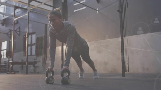 Woman placing KBs, bracing plank, doing single-arm rows in gym, HUD tracking reps for core strength