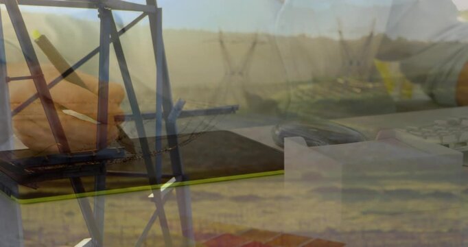 Forearm entering frame, hand tapping and sliding to operate yellow phone with tower overlay