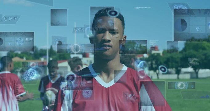 Vertical video: Tracking teen in red kit reaching to receive incoming white ball on field with HUD