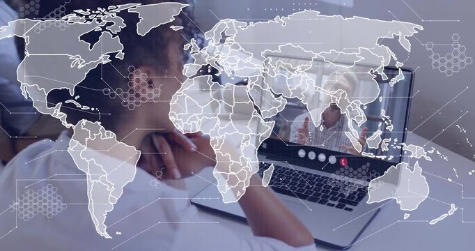 Vertical video: Woman watching laptop while man talking on screen causing map overlay for tech