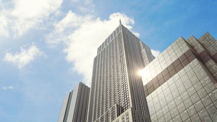 Obraz premium Modern Skyscrapers in Business District Under Blue Sky