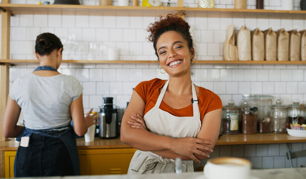Portrait, entrepreneur or woman with arms crossed in coffee shop, restaurant industry or customer service. Smile, manager and business owner with confidence for hospitality, welcome and startup cafe