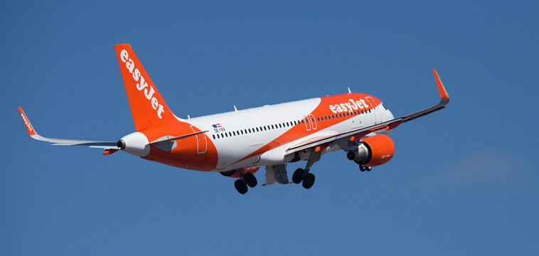 Tenerife, Spain March 6st, 2026. Airbus A320-214 easyJet airlines, flies in the blue sky. Takeoff at Tenerife Airport. Retracting the landing gear
