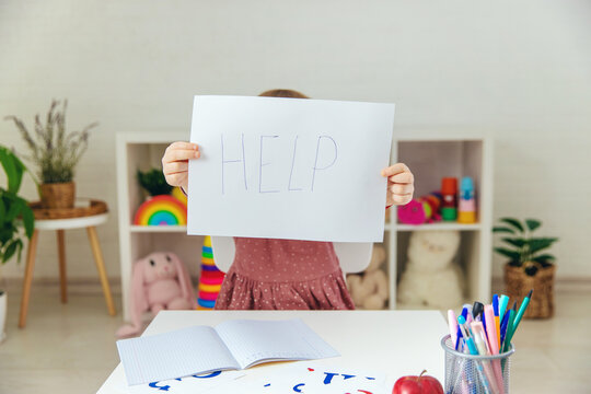 The child is doing homework at home, please help. Selective focus
