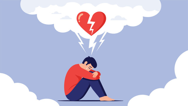 Sad man sitting on the ground feeling lonely and heartbroken while thinking about a painful relationship breakup.