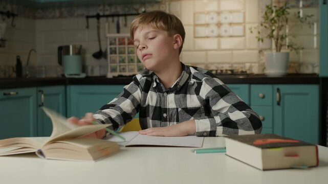 Bored Boy Doing Homework at Home
